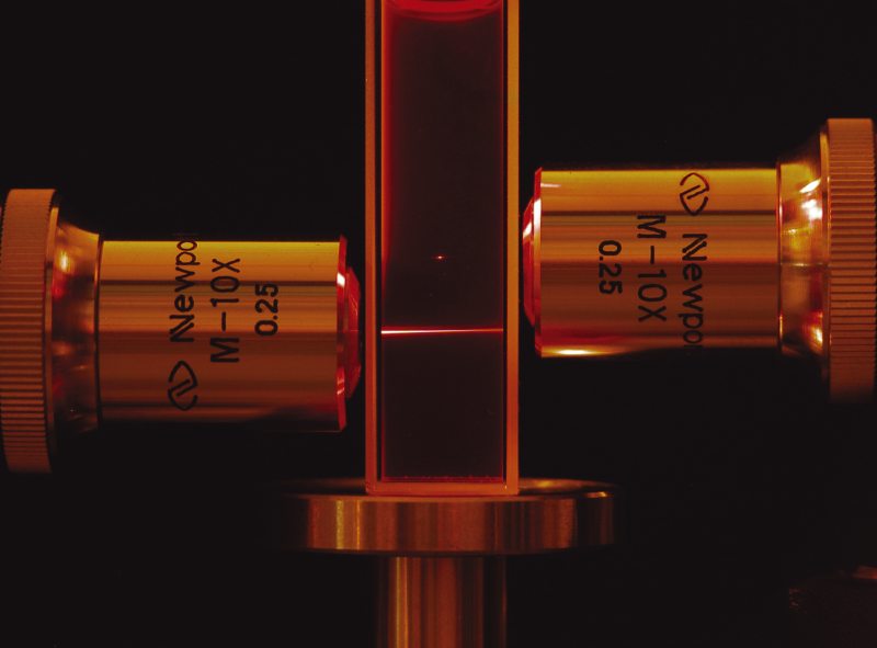 Comparison of one-photon fluorescence (lower beam) and 2PF (upper beam) in a fluorescent dye cell