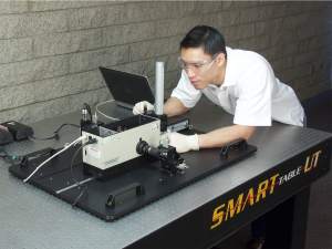 technician performing a calibration procedure on an Oriel monchromator